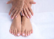 Manicure and pedicure concepts - close up on hands and feet at the beauty salon